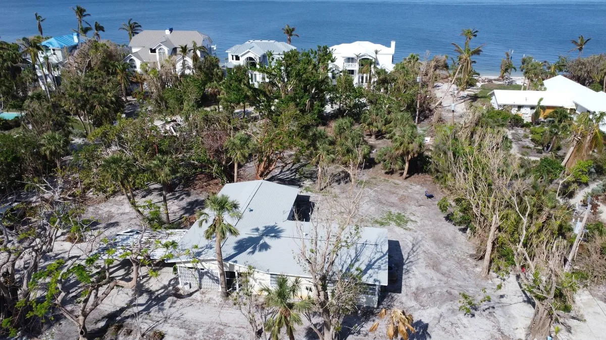After the hurricane on Sanibel — the island stripped bare, the Blue Dog roof untouched