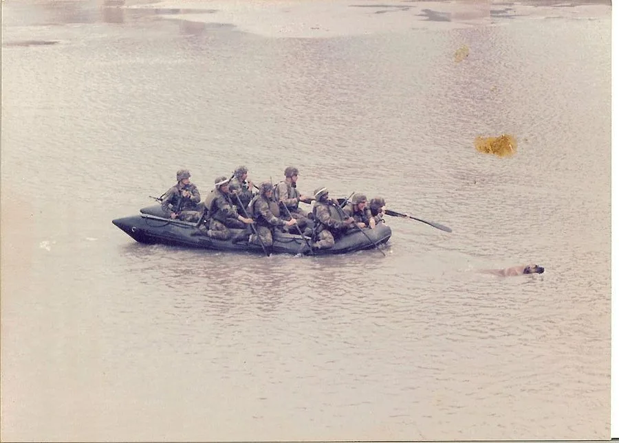River crossing with Conan, the battalion mascot, swimming alongside