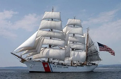 Crew on deck of the Eagle at sunset