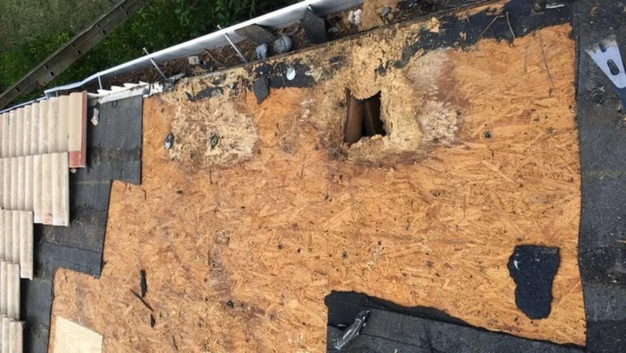 Rotted decking exposed under the tile on a Preserves at the Shores unit