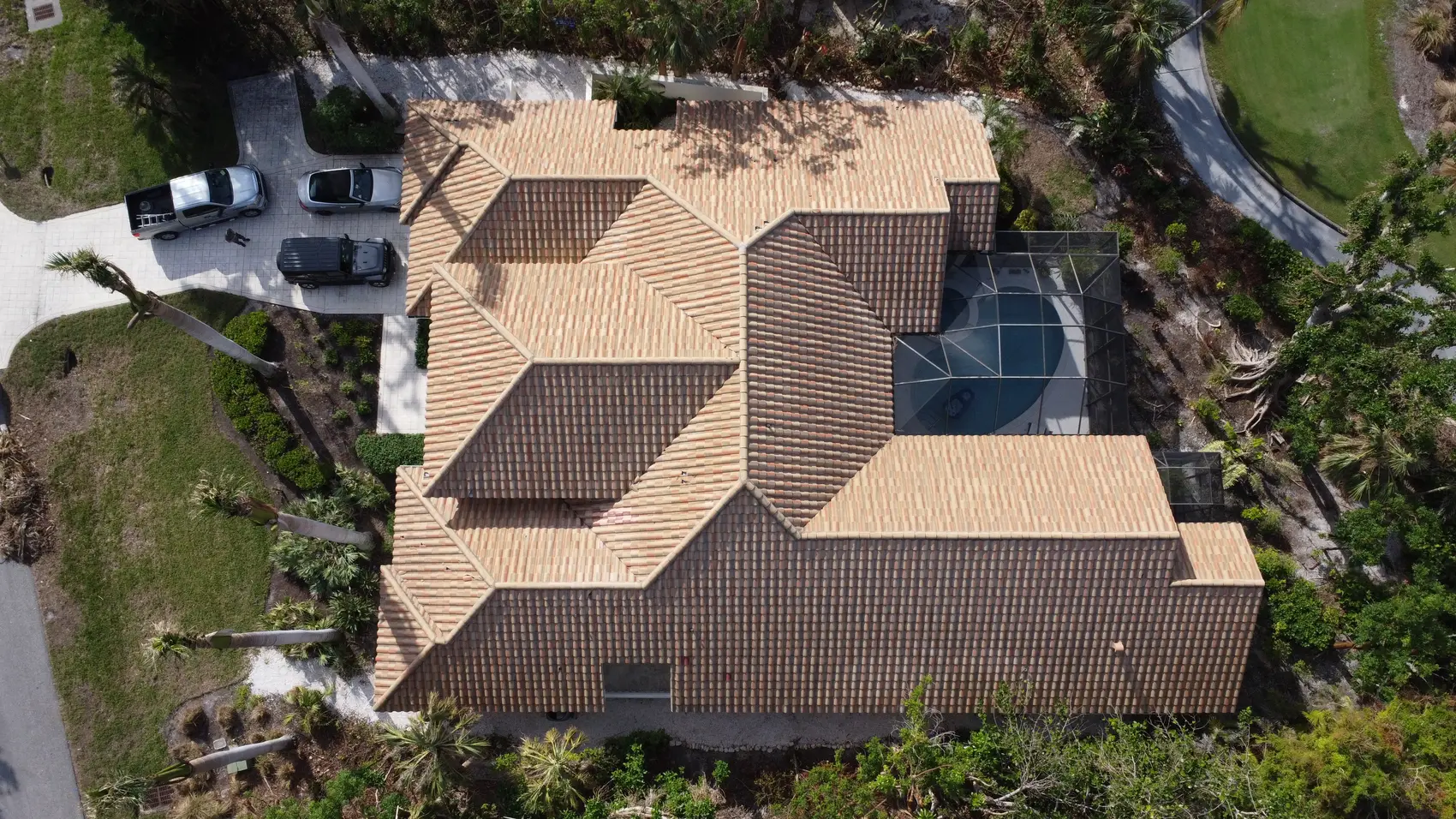 New barrel tile roof on a Bonita Springs pool home beside the golf course