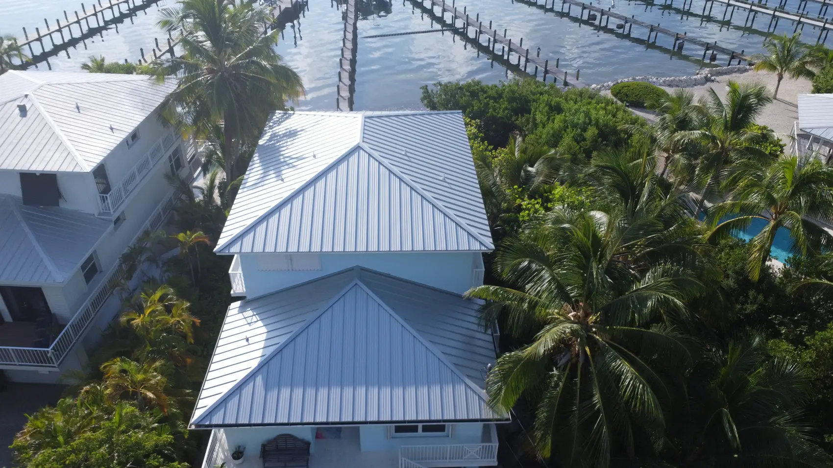 Two-story harbor-front Punta Gorda home with a new standing-seam metal roof