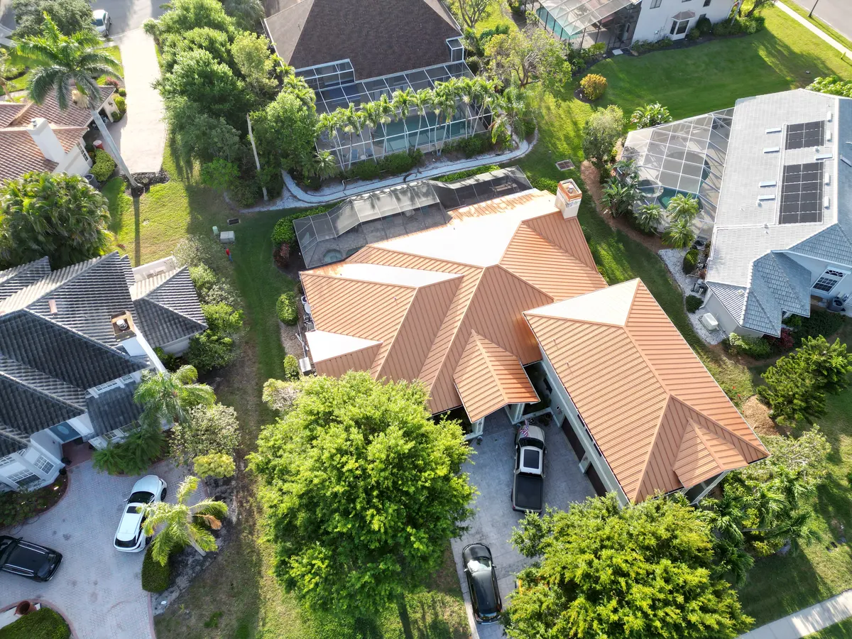 Aerial view of a terracotta standing-seam metal roof in Fort Myers