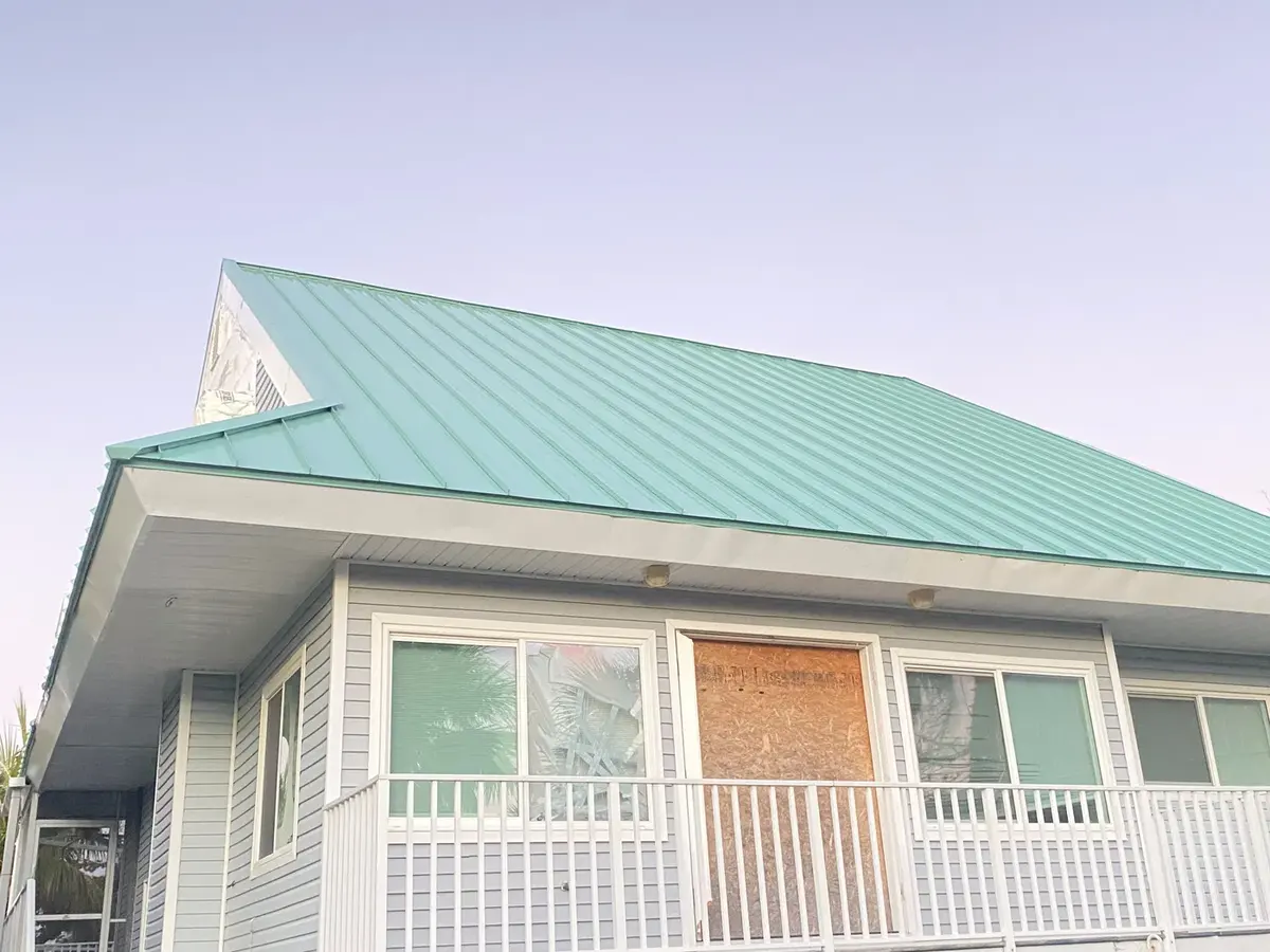 Seafoam standing-seam metal roof on a Sanibel home