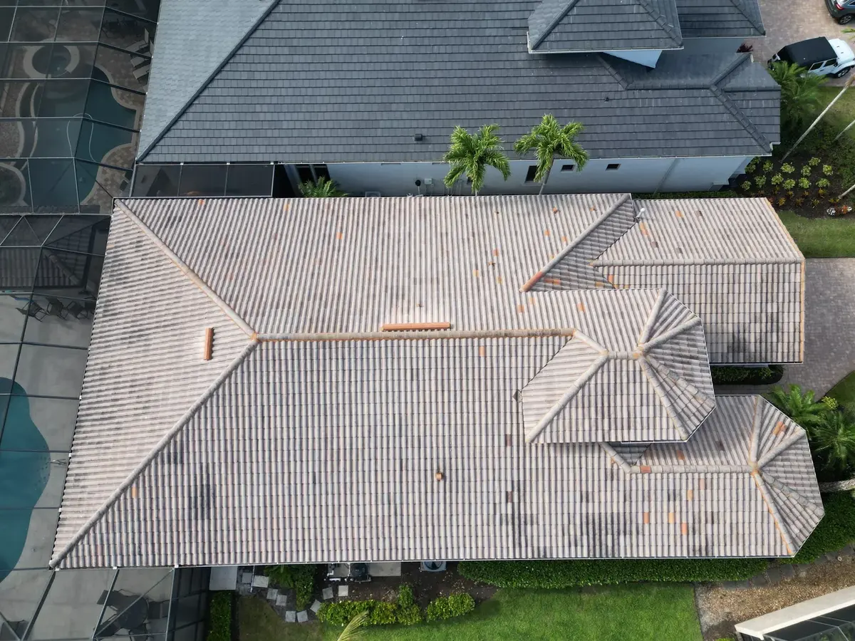 Aerial view of a finished flat tile roof on a Cape Coral pool home