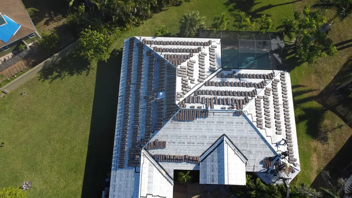 Aerial view of a finished flat tile roof on a Bonita Springs pool home