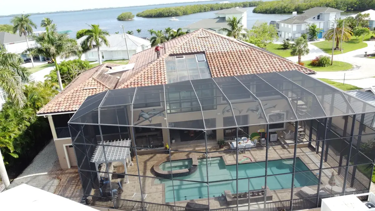 Aerial view of a tile roof with a turret on an Estero home