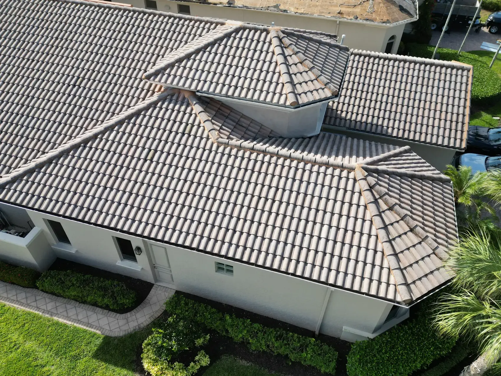 Aerial view of a finished flat tile roof on an Estero lakefront pool home