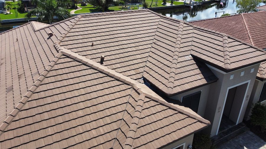 sand color flat tile roof repair